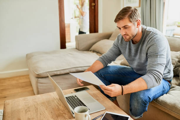 istock Figuring out his financial plan at home 1018874770