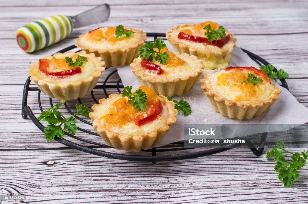 Tartlets with vegetables Tartlets with vegetables and cheese on wooden background. Selective focus. Stuffed Stock Photo