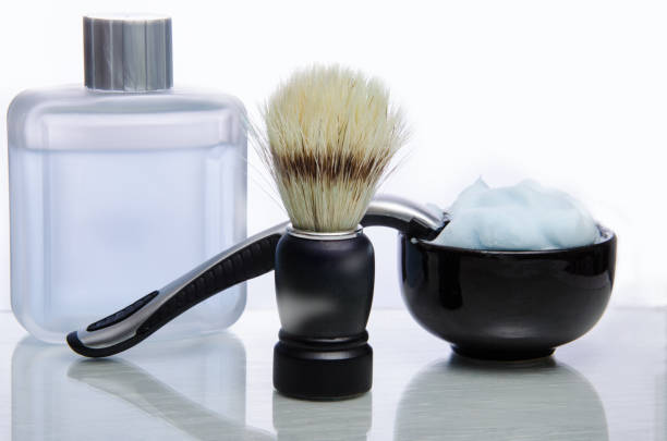 istock Shaving accessories. Glass table with reflections. White background. 1018880570