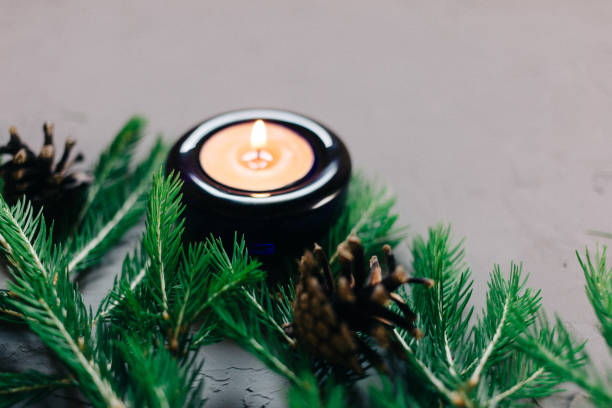 istock Close up Christmas background with fir tree and decor, candle, Top view with copy space, gray background 1018889132