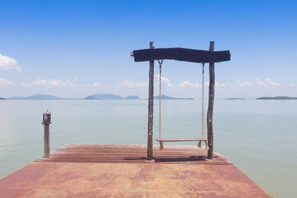 istock Swing hang  over the sea. 1018889596
