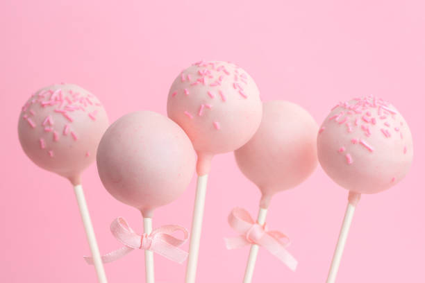 istock glazed cake pops over pink background, concept of Valentines day 1018897522