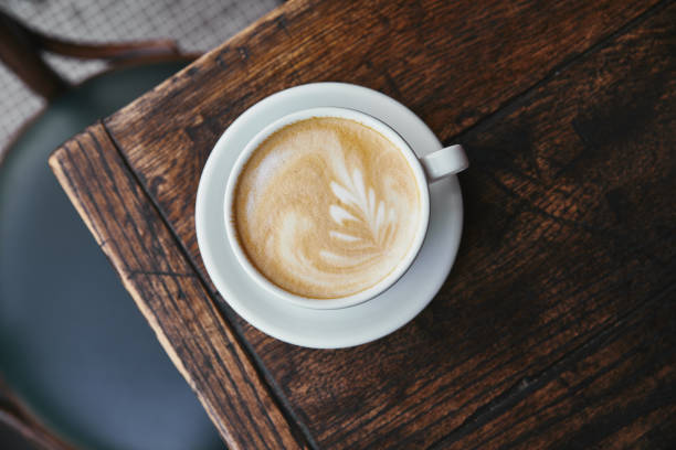 istock top view of cup of fresh coffee on rustic wooden table 1018900638