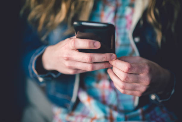 istock Girl texting on the phone 1018902944