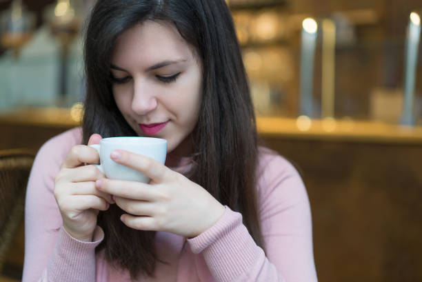 istock Brunette Beauty With Coffee in Coffee Shop 1018914480