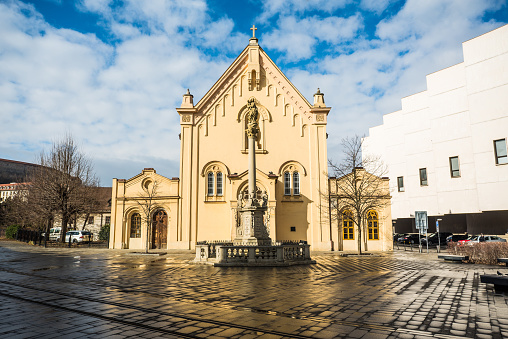 Wide angle shot of Capuchin Church in Bratislava. Dedicated to St Stephen of Hungary. In front of the church is a plague column dedicated to the Virgin Mary.