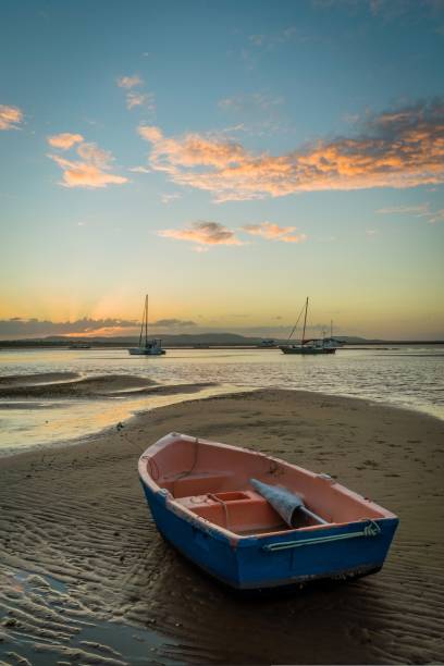 istock Rowboat at dusk in a marina in Australia 1018925678