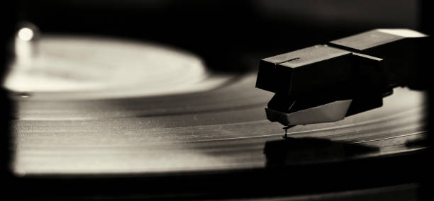 istock Macro of an old vinyl record player in black and white 1018929108