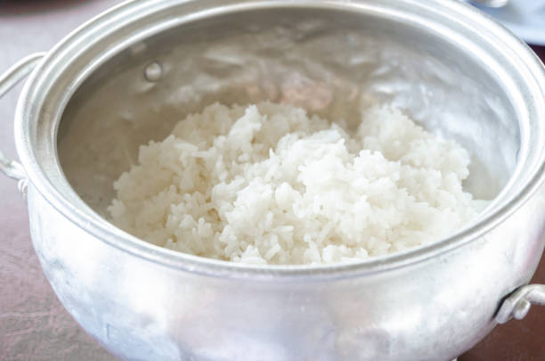 istock White cooked rice in stainless pot. Thai Jasmine Rice 1018932108