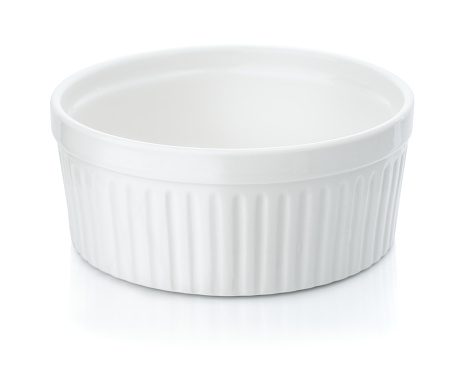 Round ceramic baking dish isolated on white