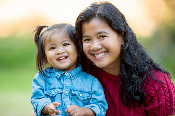 istock Mother and daughter smiling 1018943040