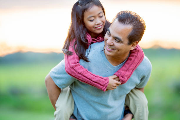 istock Father carrying daughter 1018943058