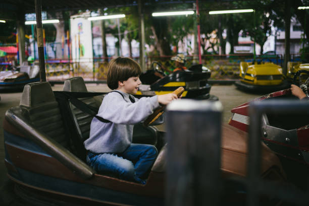 istock Little boy riding a bumper car 1018948264