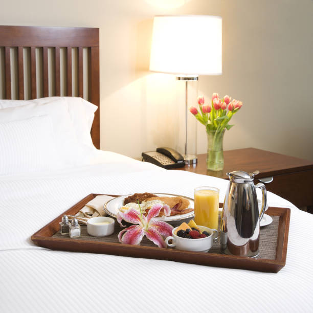 istock Breakfast on bed decoration in bedroom interior 1018959024