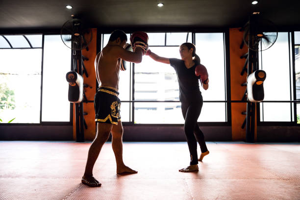istock Muay Thai workout - Motivational training at the gym facility 1018960108