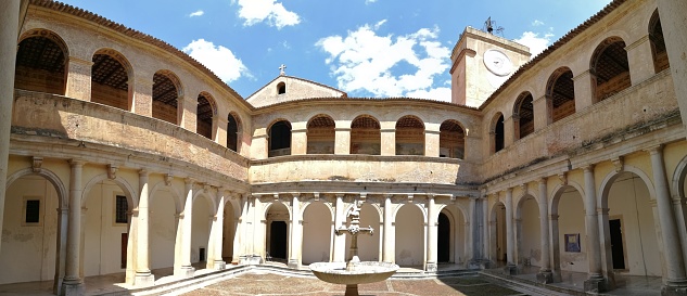 Padula, Salerno, Campania, Italy - August 5, 2018: Panoramic picture of the Cloister of the Certosa di San Lorenzo guest house