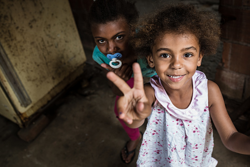 Brazilian girl making V sign with her fingers