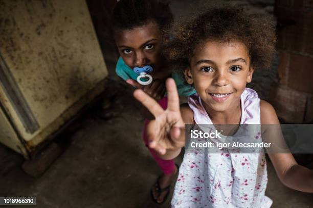 Brazilian Little Girl Making Two Or V Sign With Her Fingers Stock Photo - Download Image Now