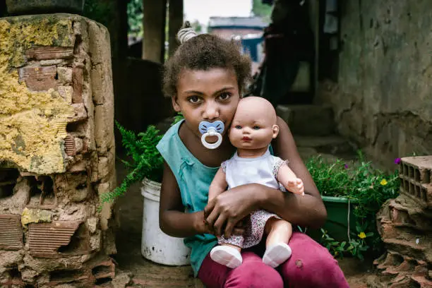 Brazilian girl holding a doll