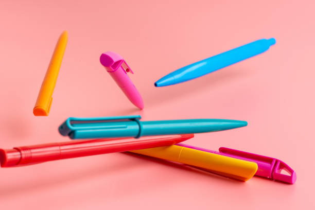 color pen on pink background Back to school Education with copy space colorful stock photo