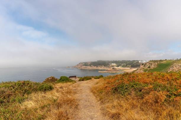 istock Sea mist at Portelet Bay, Jersey. 1018969078