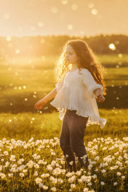 istock Curly baby resting on meadow outdoors. 1018978430