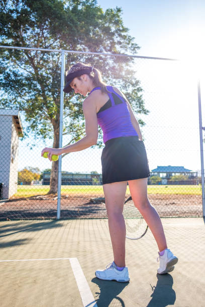 istock female tennis player on a summers day 1018987640