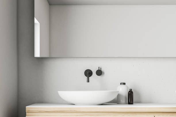 istock White bathroom sink in a concrete room 1018988148