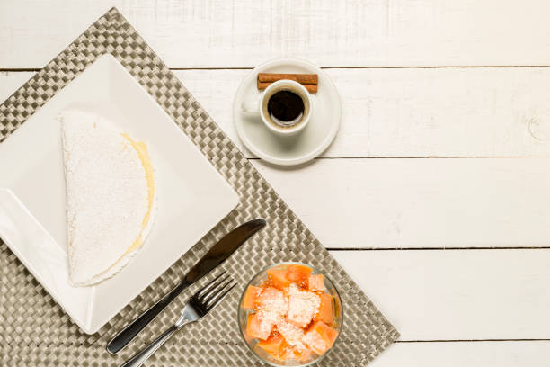 istock Breakfast, tapioca with white cheese, papaya with oats and honey and coffee 1018990792