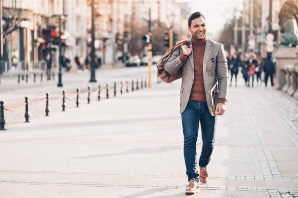 istock Smiling businessman in the city 1018990928