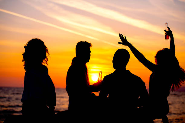 istock Young Adult Summer Beach Party Dancing Concept 1018991296