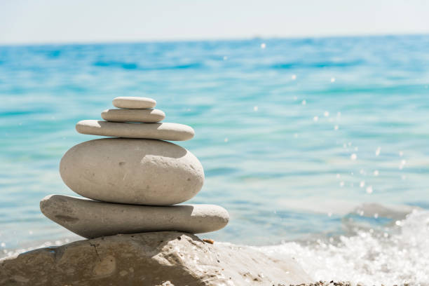 istock White stones stacked in a pile on the seashore 1018991492