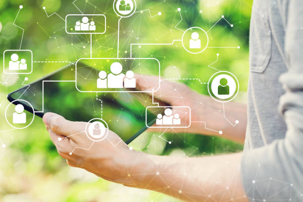 istock Social connections concept with man holding his tablet 1019006064