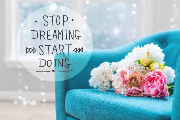 istock Stop Dreaming Start Doing message with flower bouquets with chai 1019006204