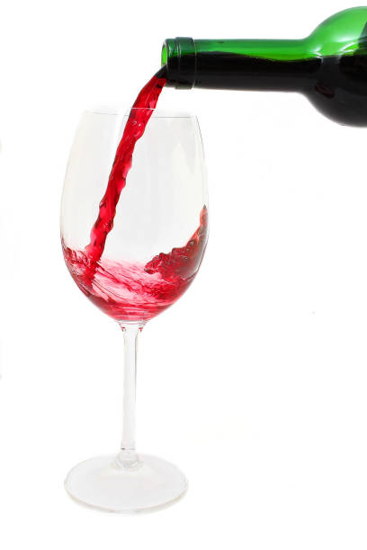 istock Pouring red wine into the glass 1019025600