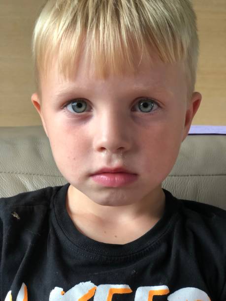 istock Sulking blond five year old boy 1019025984