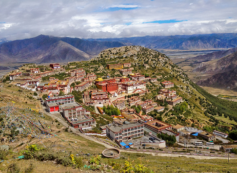 Tibetan Ganden Buddhist Monastery lies in a hilly natural amphitheater Mountains and dramatic views over the valleys near Lhasa, Tibet. The place for meditation and pilgrimage, hermitage or retreat.