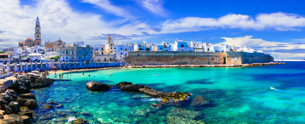 Beautiful white town Monopoli in Puglia with turquoise sea. Italy italian summer holidays in Puglia bari photos stock pictures, royalty-free photos & images