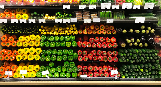 A colorful display of fresh vegetables in a grocery market store.