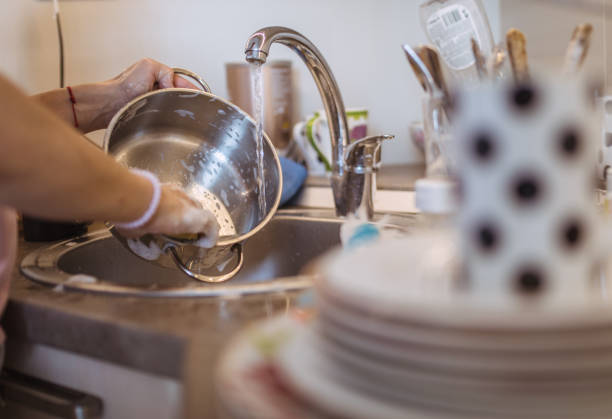 istock Woman washing dishes 1019046226