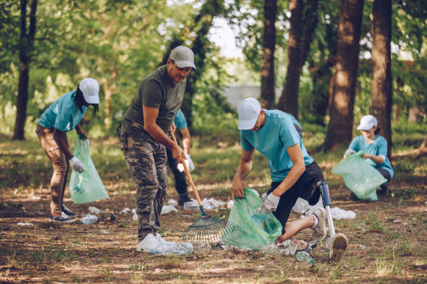 istock Busy volunteers cleaning park 1019057990