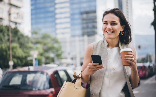 istock Businesswoman walking and texting 1019058784