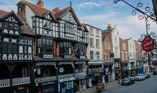 The Market Square in Woodbridge, Suffolk, Eastern England, where the weekly Thursday food and produce market is held. To the right is the Victorian Gothic style town water pump house, constructed in 1876. Woodbridge has many old buildings and is an attractive town beside the River Deben.