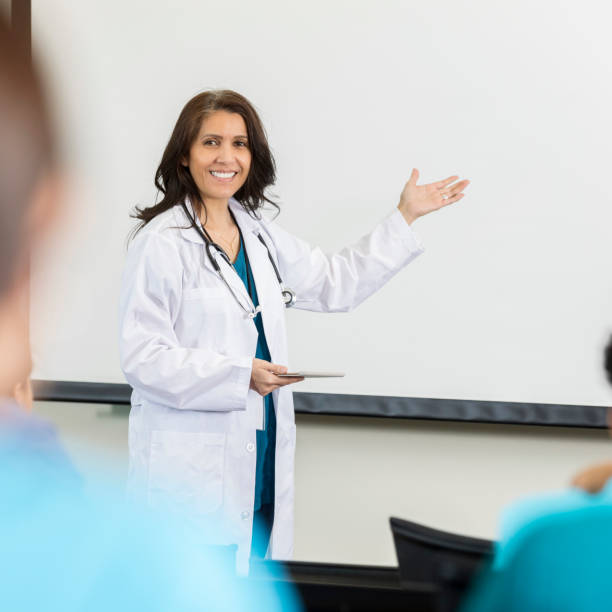 istock Confident medical professor speaks to students 1019065698