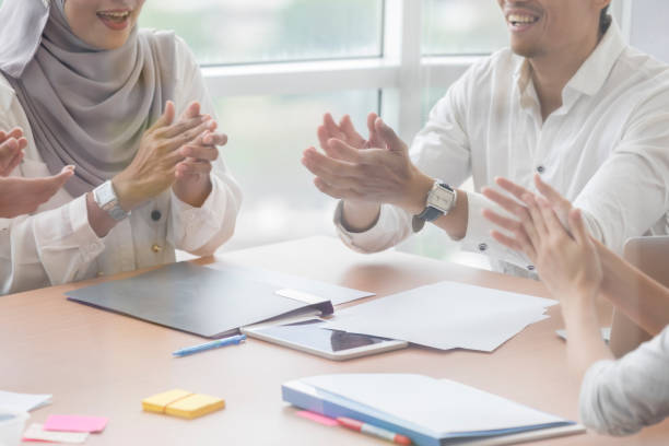 istock Businesspeople applaud during meeting 1019065776