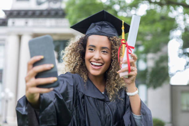 istock College graduate taking selfie 1019066142