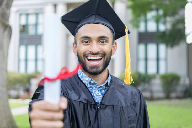 istock Confident young Indian man with college diploma 1019066166