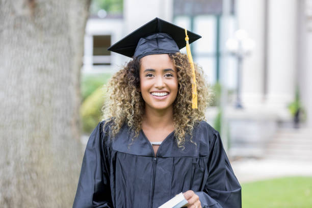 istock Pretty female college graduate 1019066178