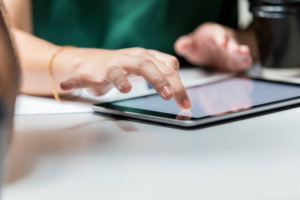 istock Unrecognizable businesswoman uses digital tablet 1019066210