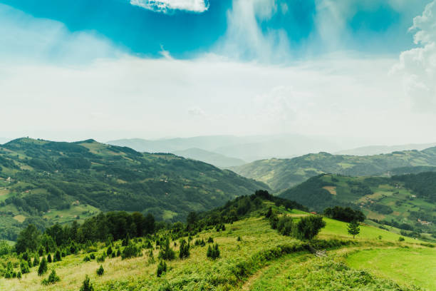 Rural landscape with mountains in horizon. Wide angle lens shot by day